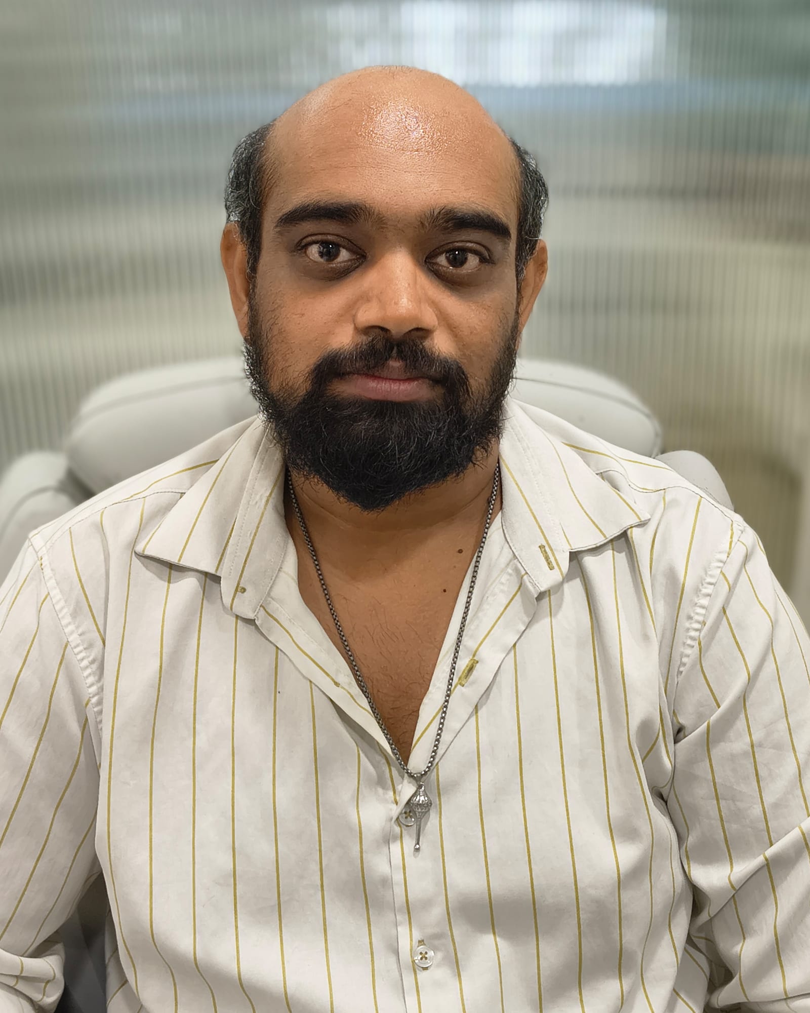 Before — hair loss over the top and crown with greying hair at the sides